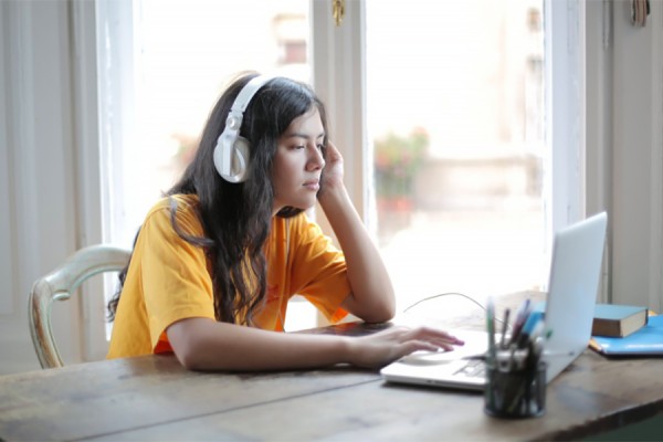 student at laptop computer