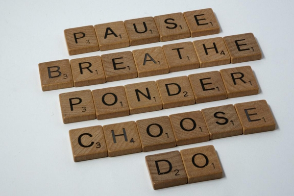 scrabble tiles spelling "pause" and similar de-stressing terms