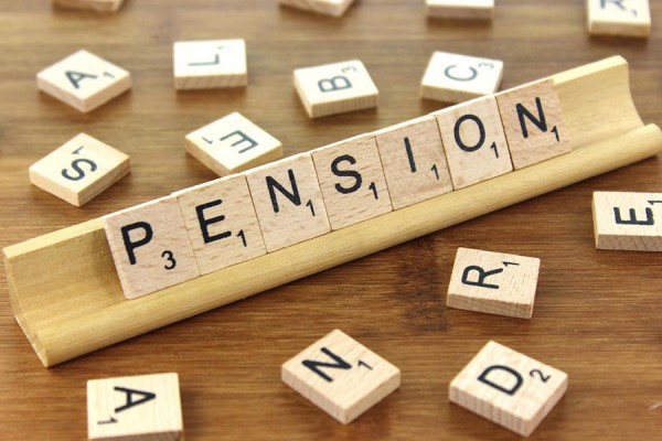pension spelled out in Scrabble tiles