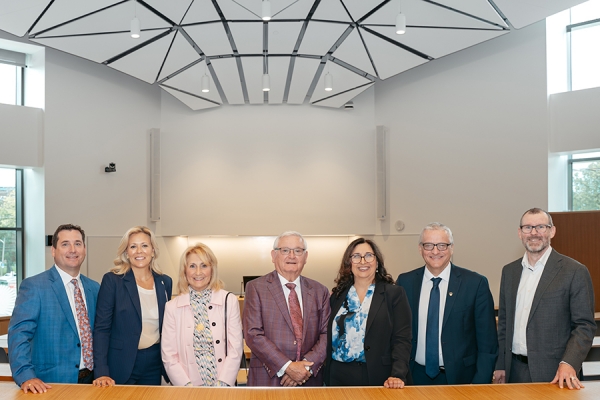 members of the Rodzik family and university administration in the Moot Court