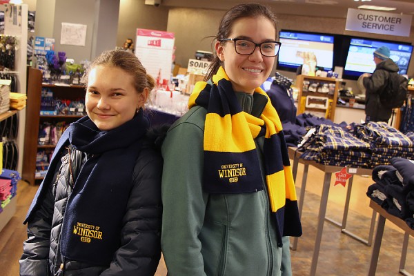 Yuliyana Tubakovic and Victoria Bradford wearing scarves