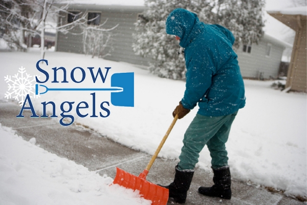 person shoveling snow from sidewalk