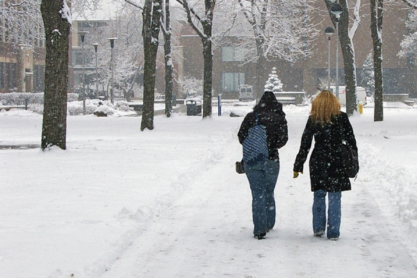 students walking in snowfall
