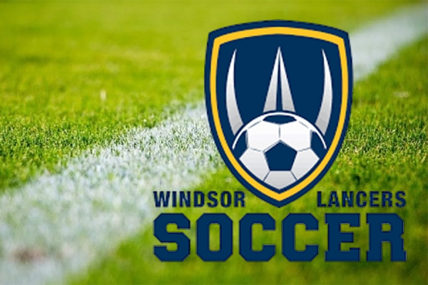 soccer logo over grassy field