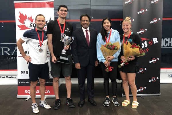 Group photo of squash tournament participants.