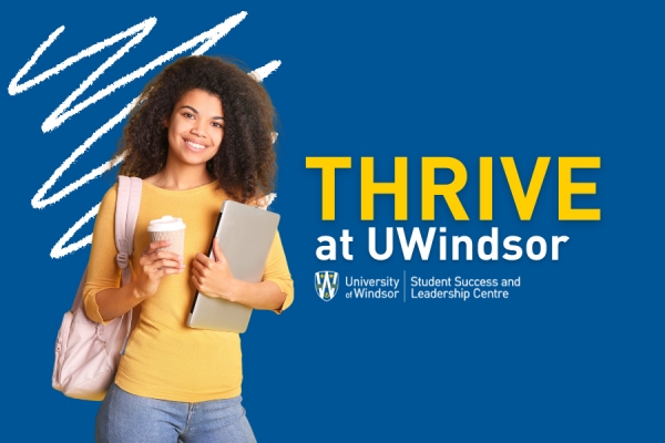 Young woman before banner reading &quot;Thrive at UWindsor&quot;