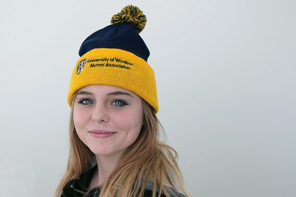This toque in Lancer colours, modelled by drama student Paige Romberg, will warm up the entrant who won it in a trivia contest.