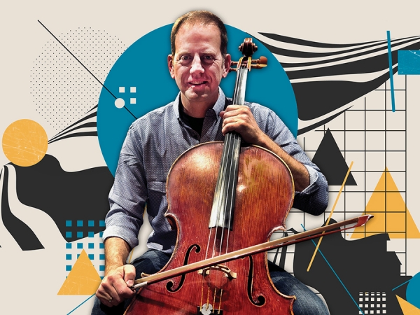 Andrew McIntosh holding cello