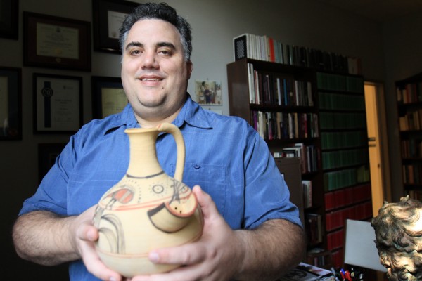 UWindsor history professor Max Nelson holds a reproduction of a Philistine beer jug from around 1200 BC in his office on Sept. 22. Dr. Nelson will participate in a symposium discussing the ancient beverage on Sept. 30.