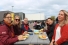 people sitting at picnic table