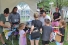 Pride volunteers hand out swag to children