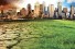 cityscape forgrounded by cracked earth