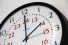 clock indicating hand moving from 2 to 3 o'clock