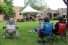Shahida Nurullah and Mike Karloff performing before people on lawn chairs