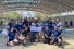 UWindsor kinesiology students wearing apparel from Tecnológico de Costa Rica in an athletics facility.