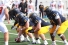 Lancer football players on scrimmage line