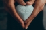 heart-shaped rock with word "hope" carved into it