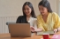 women looking at computer together