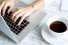 hands positioned over computer keyboard