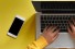 hands on laptop keyboard