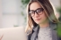 Young woman consulting laptop computer