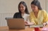 young woman looking at computer