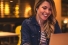 woman happily working on laptop computer