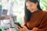 woman looking at smart phone