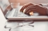 hands hovering over computer keyboard