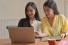 women looking at laptop computer