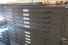 a large cabinet with flat drawers