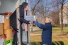 Mary Pallisco taking box from president Rob Gordon