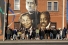 students standing below mural of historical Black figures