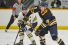 Winger Keegan McMullen checks an opponent