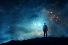 figure gazing into night sky