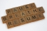 Scrabble tiles reading "Pause. Breathe. Resume."