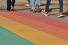 feet walking on rainbow pavement