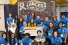 Relay for Life volunteers beneath banner reading Lancers are bigger than cancer