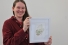 Sarah Smitherman holding a watercolour painting