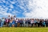 a line of conferfees standing outdoors