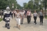 Winston, a plush knight, lead a group of walkers