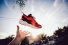 Hand holding walking shoe
