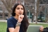 young person looking like she's thoughtfully considering her options
