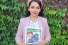 Zaynab Al-Yassiri holds a copy of her book Lunch Box Wisdom
