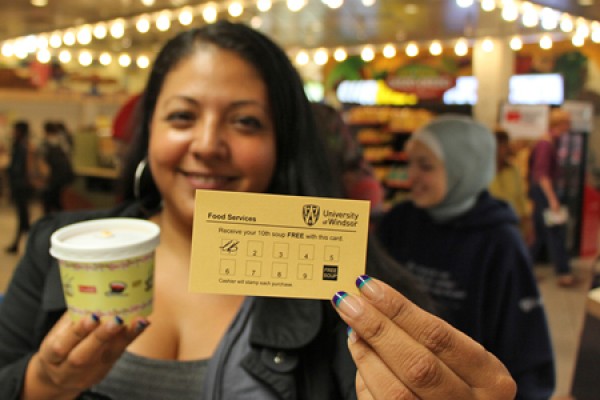 Victoria Rubio holds her frequent soup buyer card