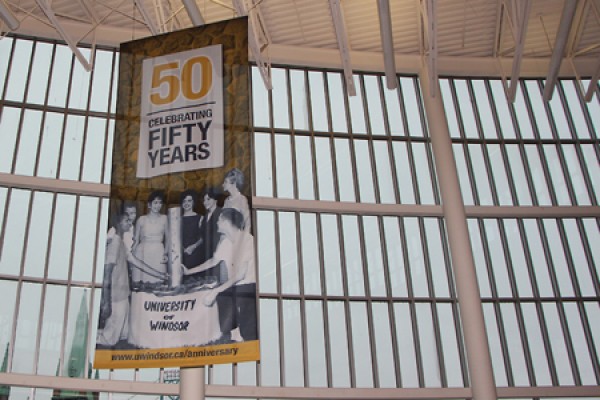 50th anniversary banner hanging in CAW Student Centre