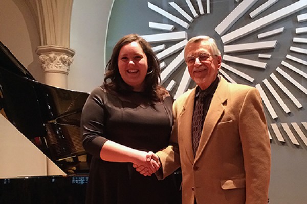 Angelica Sciacca accepts congratulations from acting performance chair Richard Householder