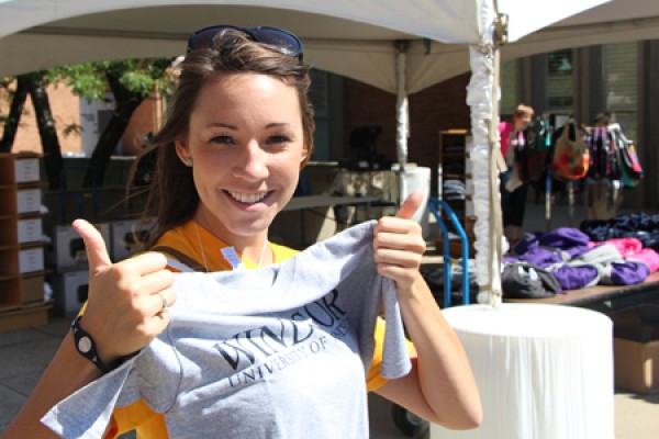 student Nicole Phaneuf holds a UWindsor T-shirt