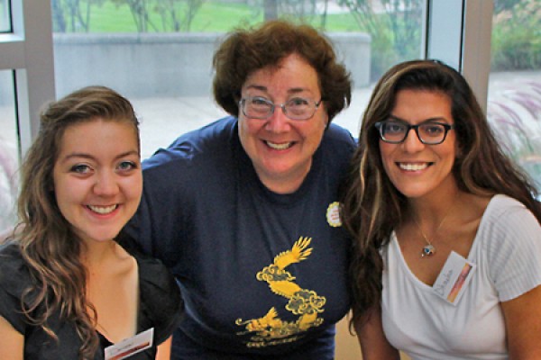 Carol Reader (centre) poses with students at a philanthropic event in September.