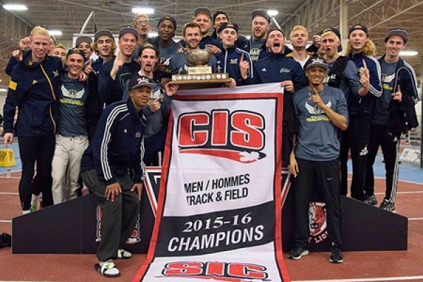 Lancer men’s track and field team holding CIS banner